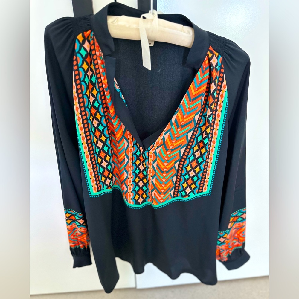 Tucker printed blouse. Tucker’s classic silk blouse.